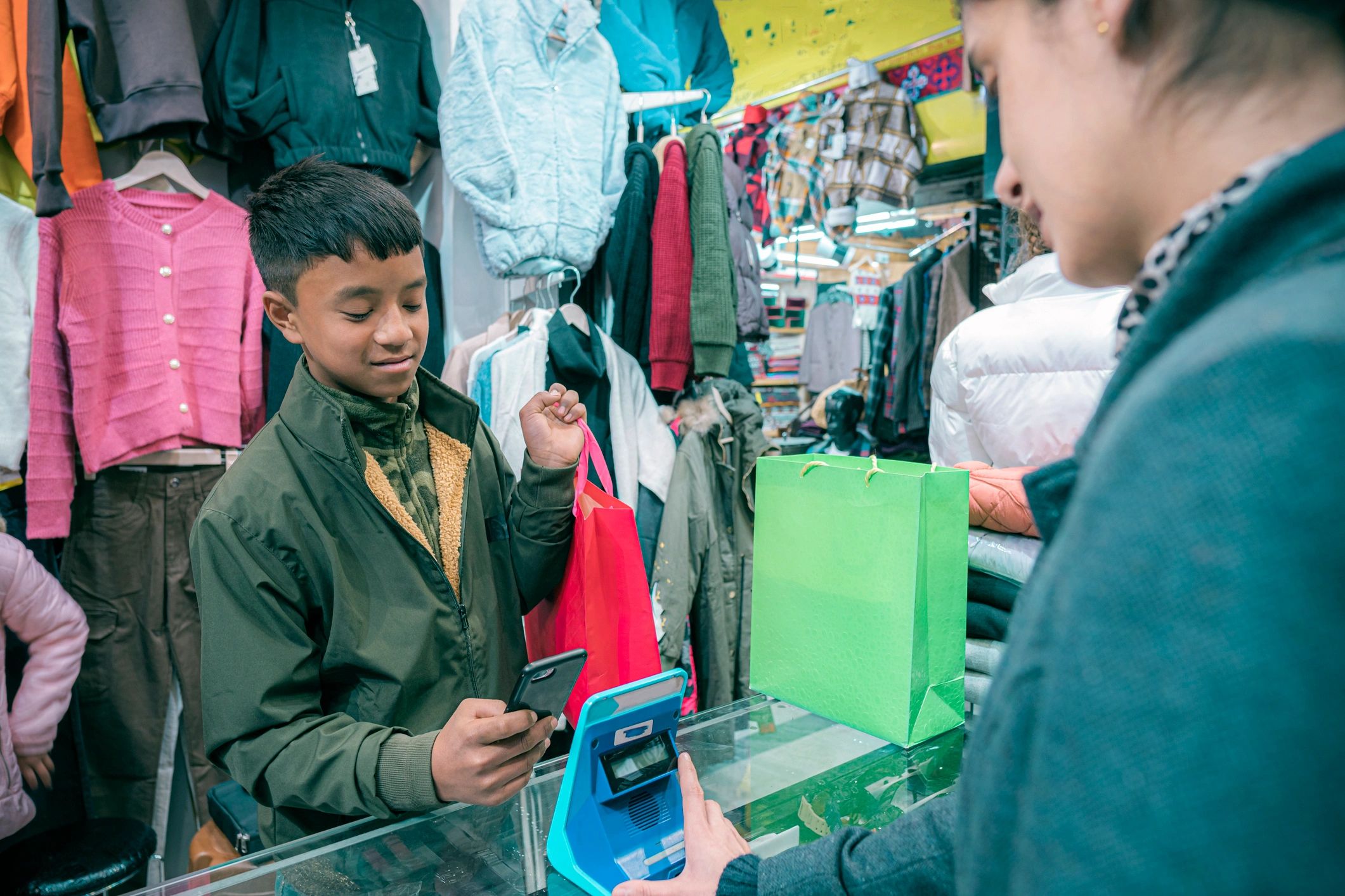 Customer paying at a garments shop