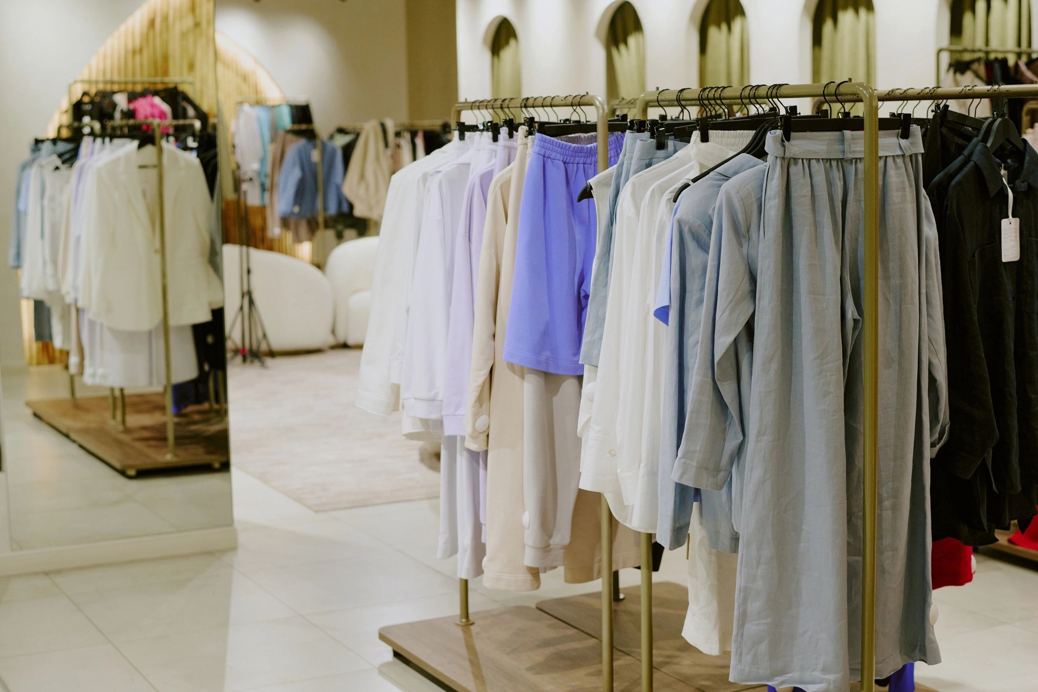 New collection displayed on hangers in a modern store