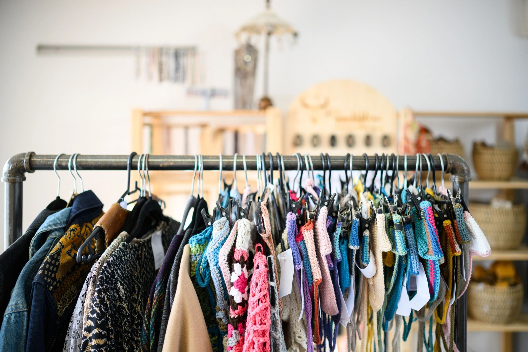 Colorful garments on a boutique clothing rack